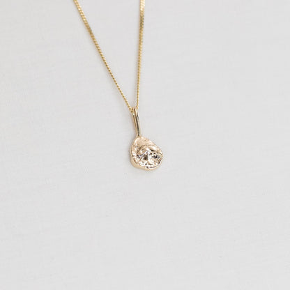 solid gold necklace with oyster texture